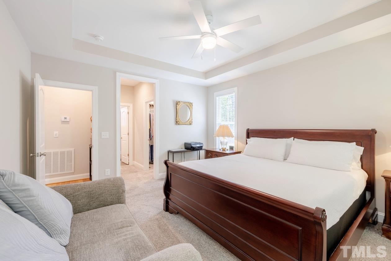 1518 Tom Oakley Road Timberlake, NC 27583 - Photo 22 of 55 a bedroom with bed couch and window