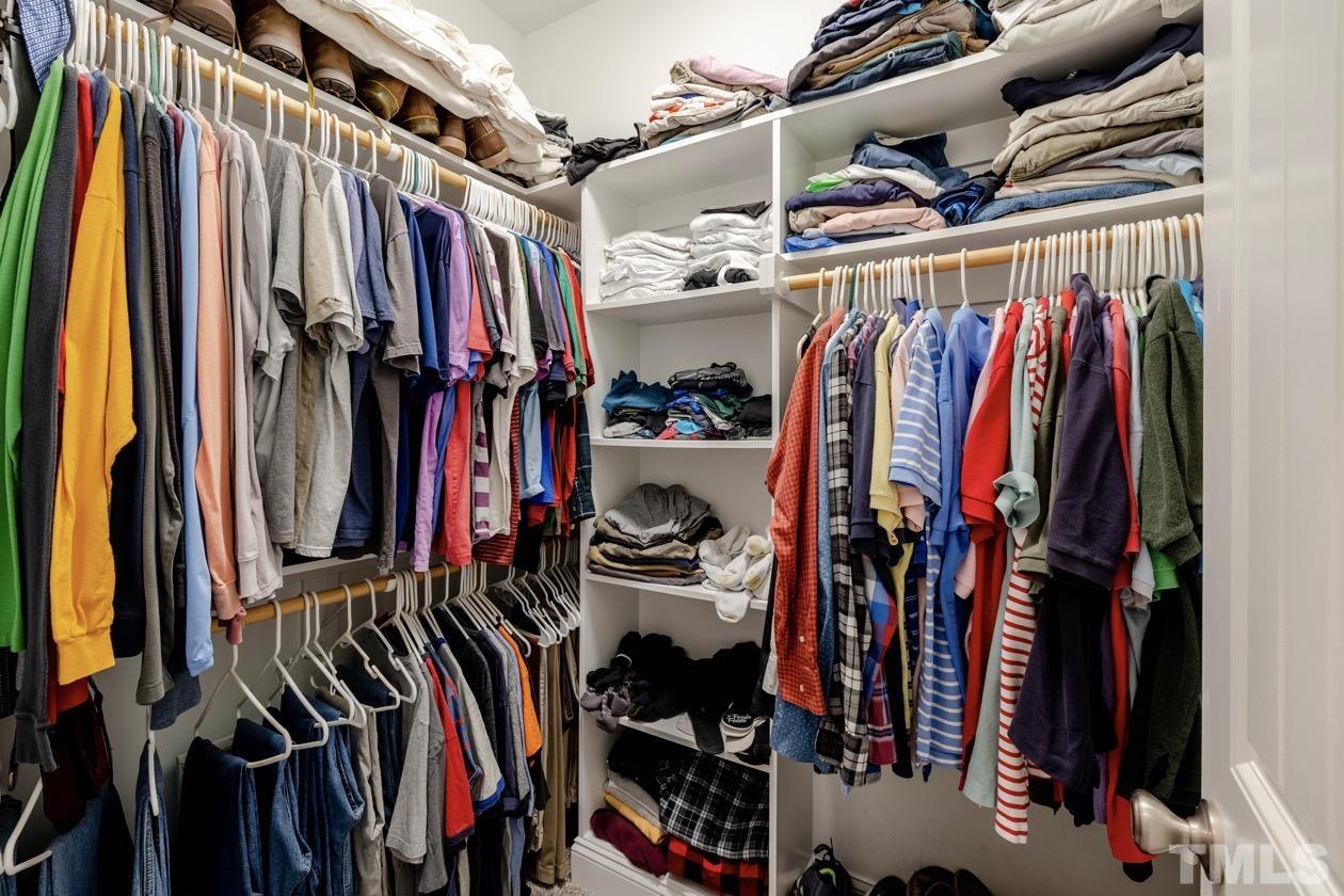 1518 Tom Oakley Road Timberlake, NC 27583 - Photo 23 of 55 a view of walk in closet with clothes