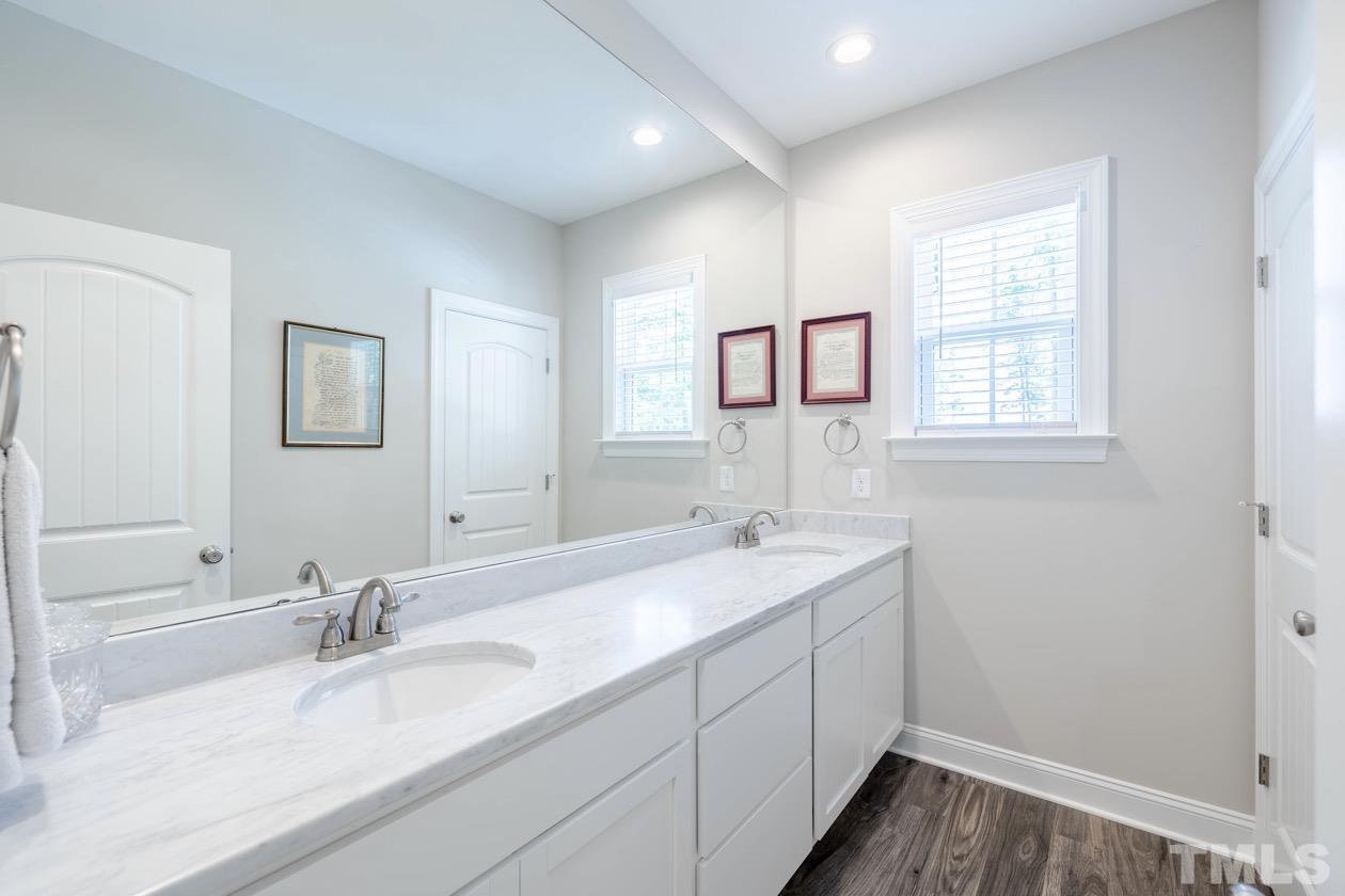 1518 Tom Oakley Road Timberlake, NC 27583 - Photo 24 of 55 a bathroom with a sink and a mirror