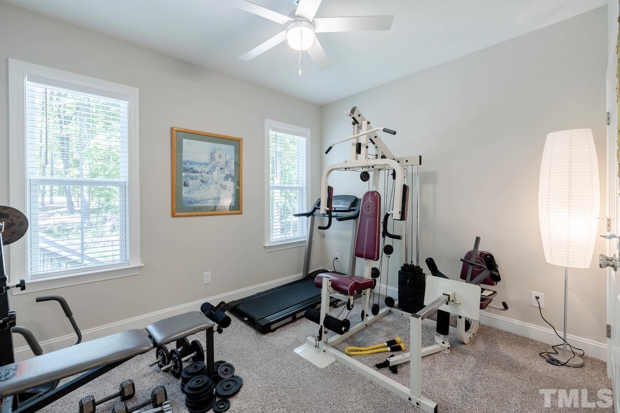 1518 Tom Oakley Road Timberlake, NC 27583 - Photo 26 of 55 a room with gym equipment and a window