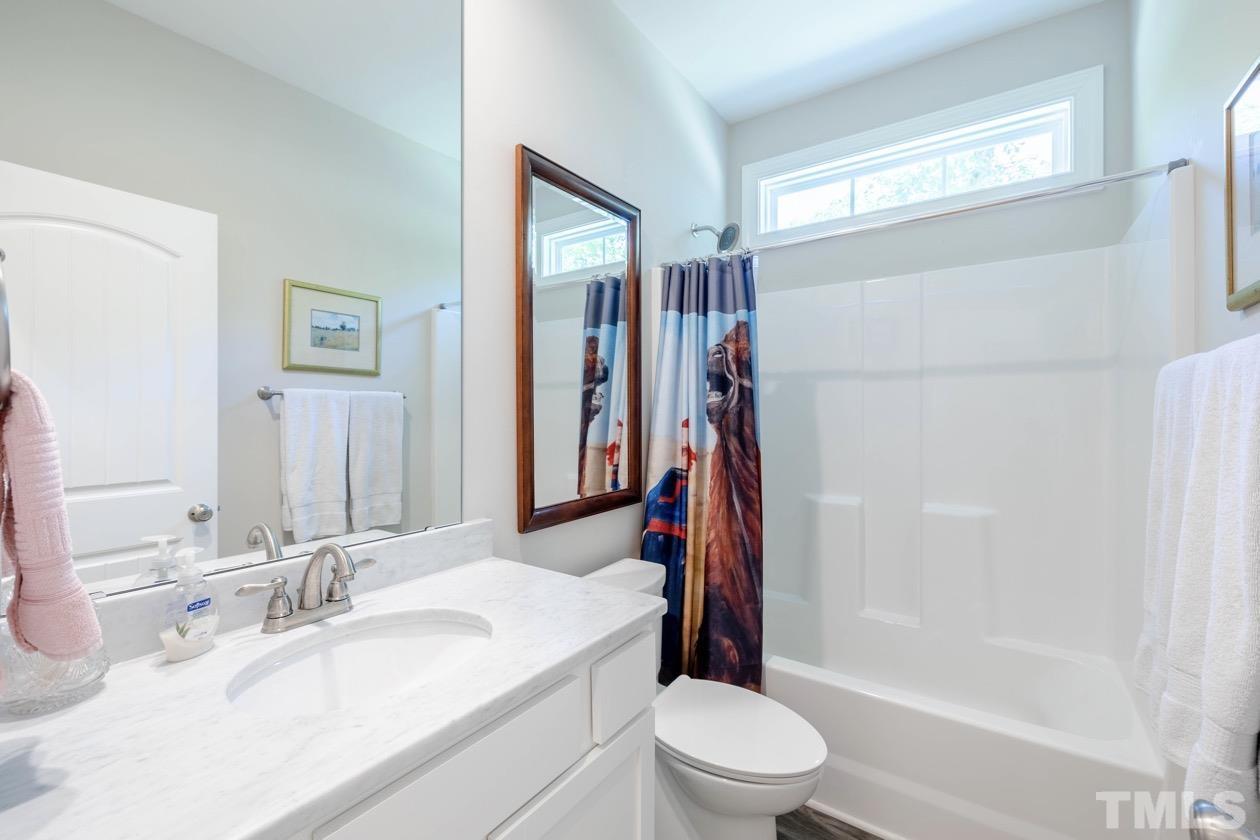 1518 Tom Oakley Road Timberlake, NC 27583 - Photo 27 of 55 a bathroom with a sink toilet and shower
