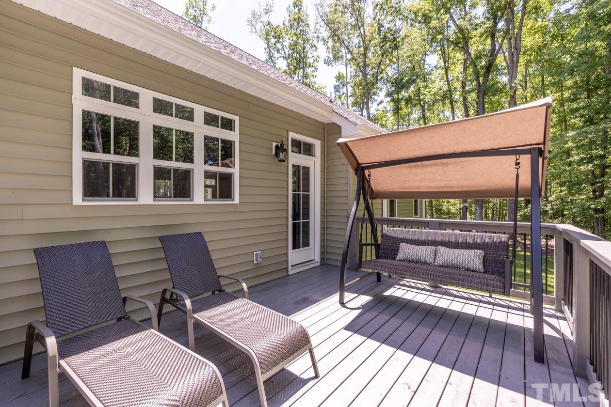 1518 Tom Oakley Road Timberlake, NC 27583 - Photo 36 of 55 a backyard of a house with seating space