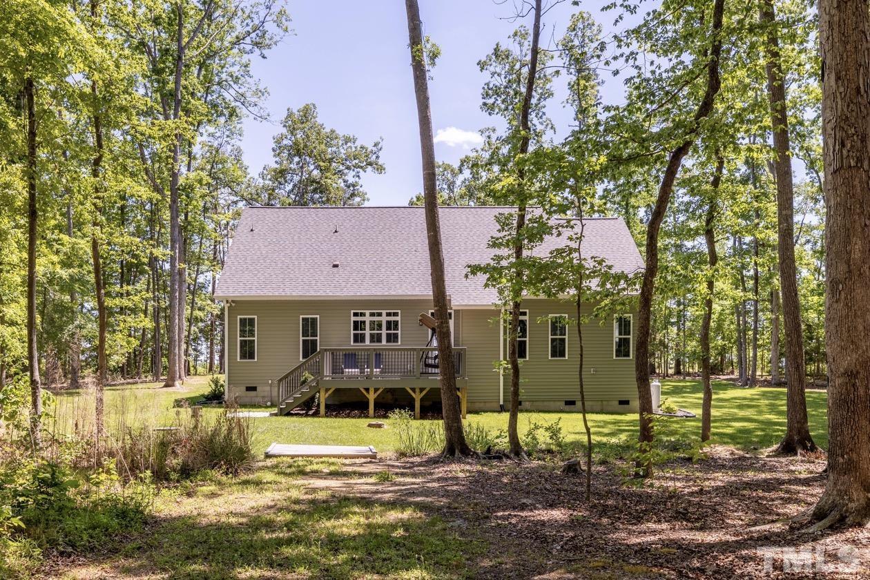 1518 Tom Oakley Road Timberlake, NC 27583 - Photo 39 of 55 a view of a house with a yard and a fountain