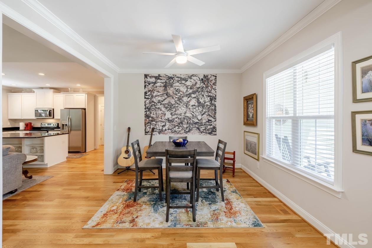 1518 Tom Oakley Road Timberlake, NC 27583 - Photo 4 of 55 a view of a dining room with furniture and wooden floor