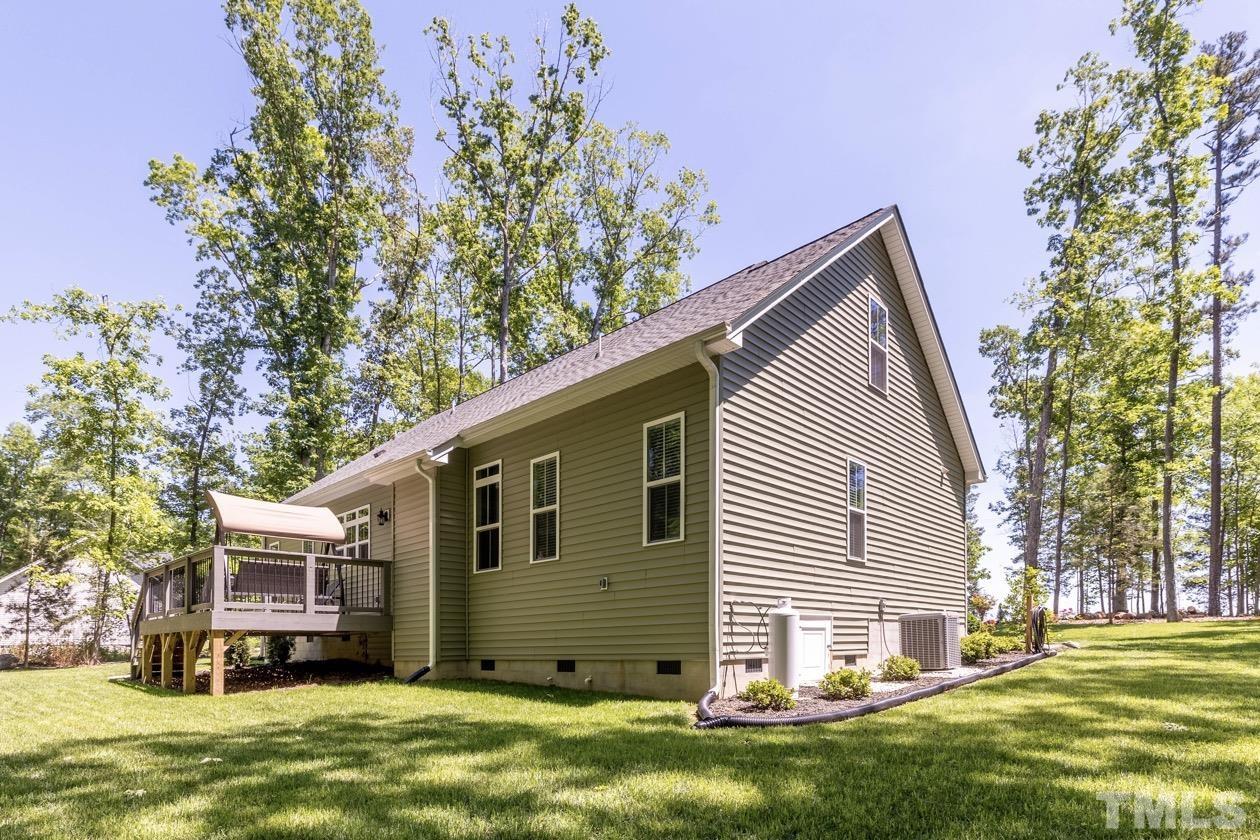 1518 Tom Oakley Road Timberlake, NC 27583 - Photo 41 of 55 a view of a house with a yard