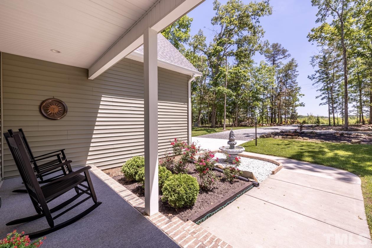 1518 Tom Oakley Road Timberlake, NC 27583 - Photo 43 of 55 a view of a backyard with sitting area