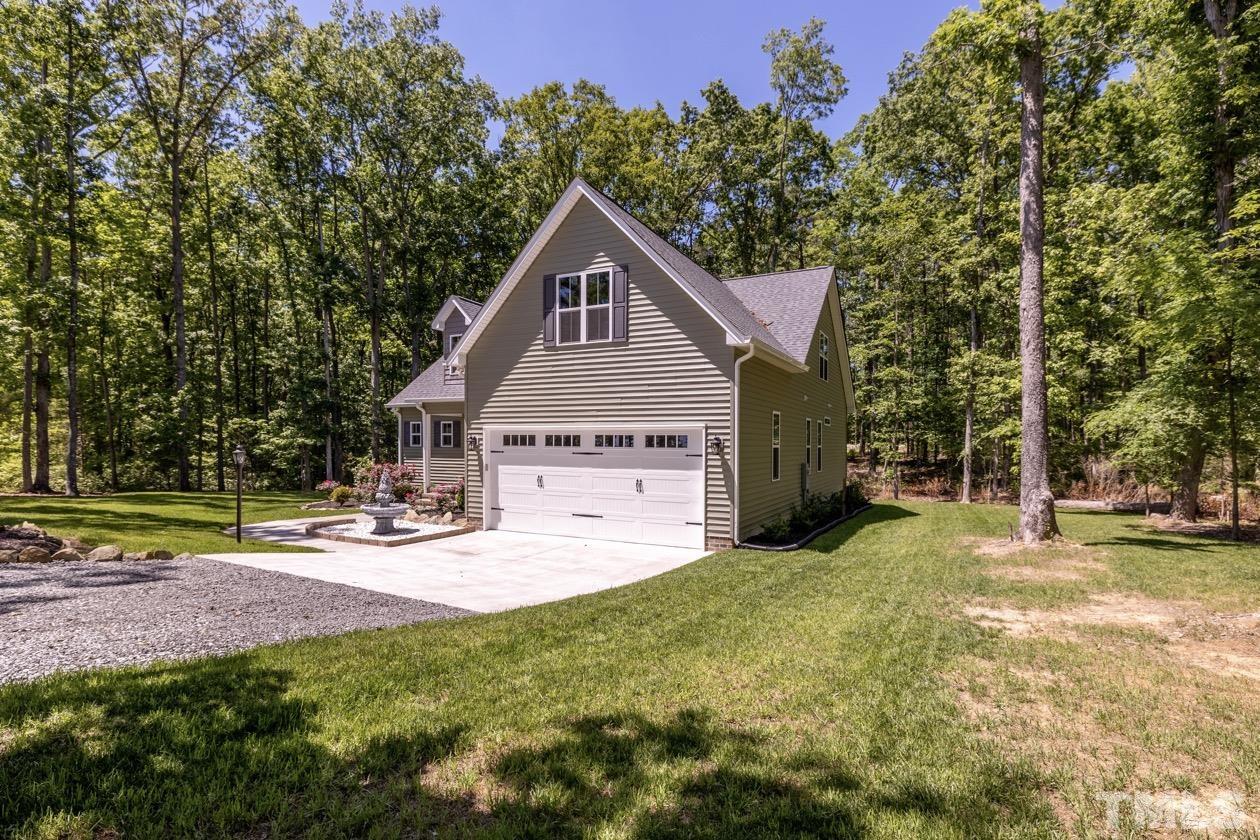 1518 Tom Oakley Road Timberlake, NC 27583 - Photo 45 of 55 a house view with a sitting space and garden