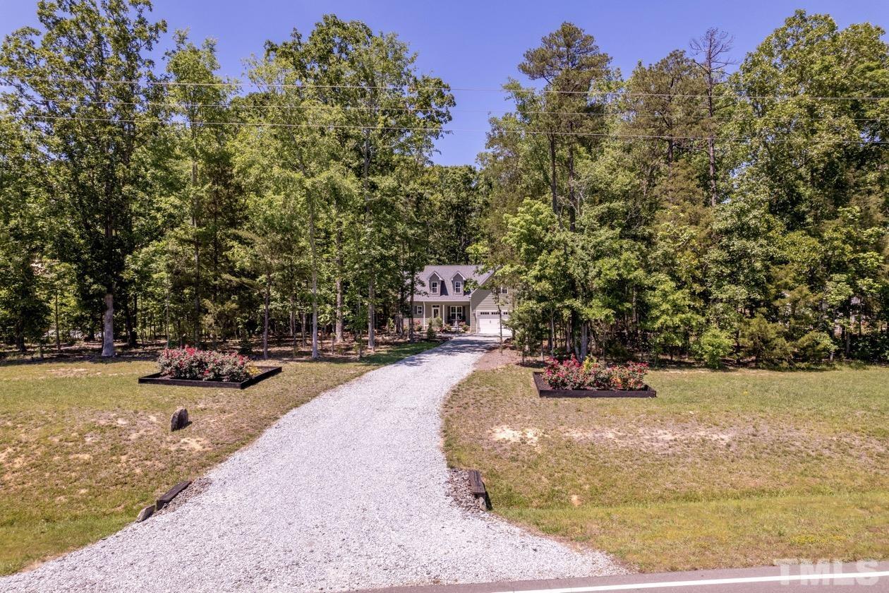 1518 Tom Oakley Road Timberlake, NC 27583 - Photo 47 of 55 a view of a swimming pool with an outdoor space and seating area