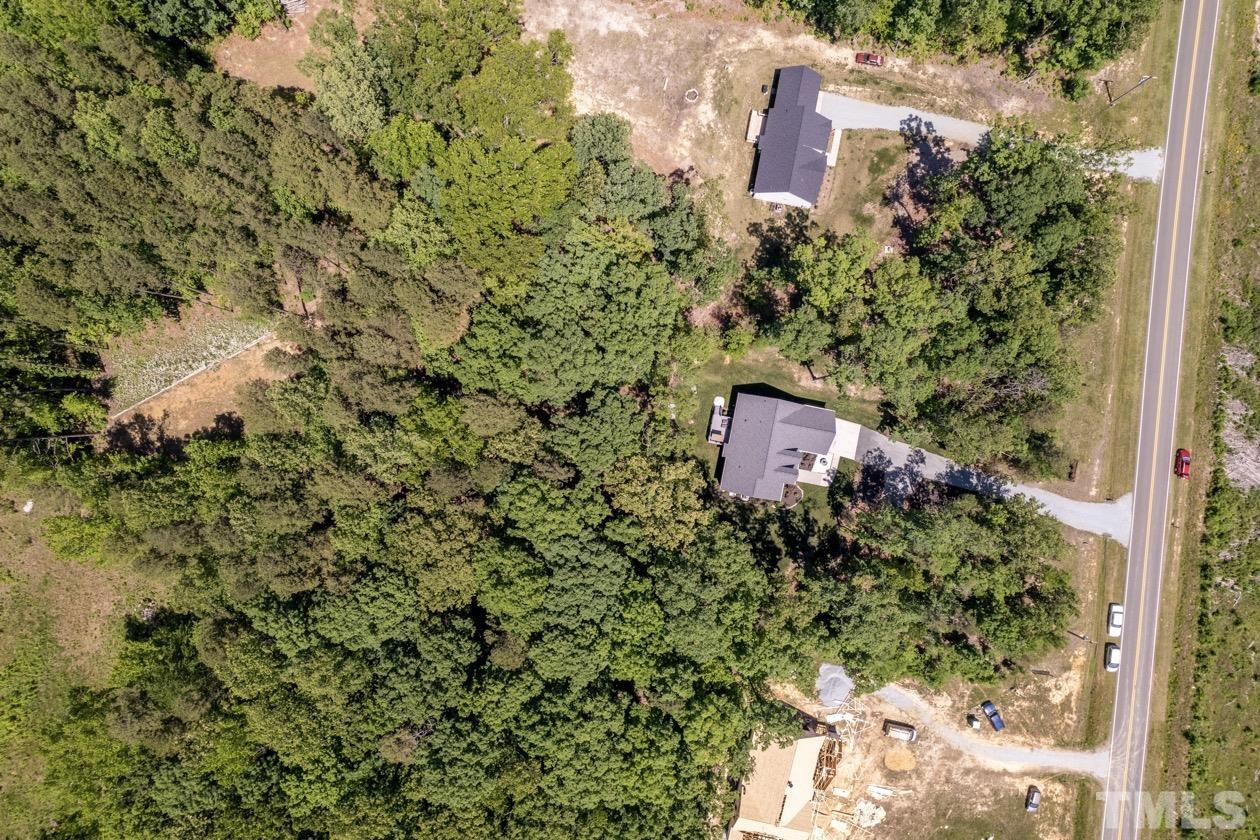 1518 Tom Oakley Road Timberlake, NC 27583 - Photo 49 of 55 a backyard of a building with lots of green space