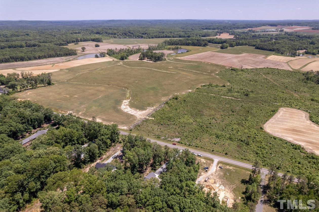 1518 Tom Oakley Road Timberlake, NC 27583 - Photo 50 of 55 an aerial view of residential houses with outdoor space and trees
