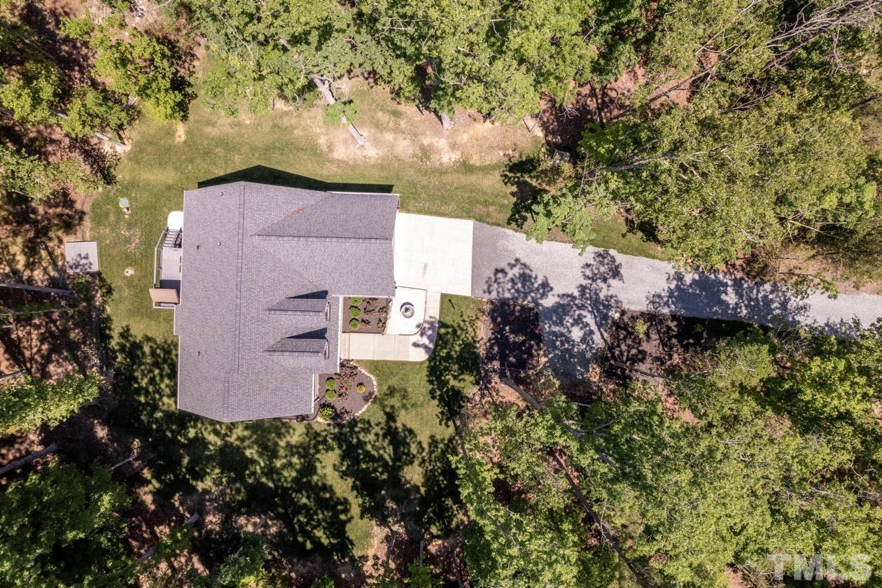 1518 Tom Oakley Road Timberlake, NC 27583 - Photo 54 of 55 an aerial view of house with yard and trees in the background