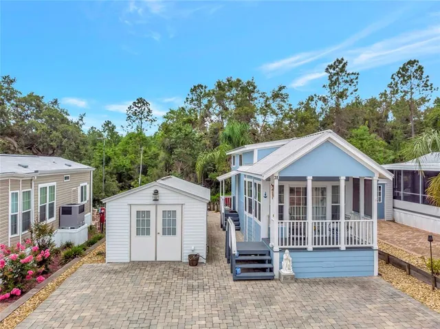 a view of a house with a garden and pathway