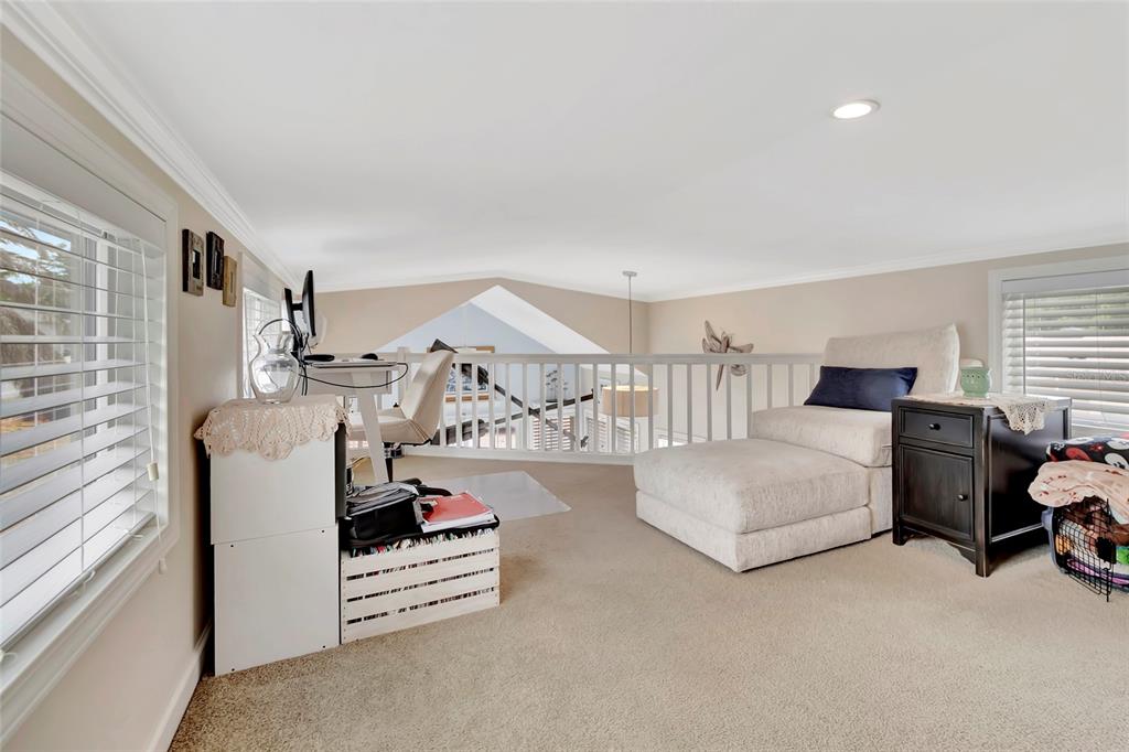 20285 Highway 27, Unit 38 Clermont, FL 34715 - Photo 14 of 33 a living room with furniture and a table