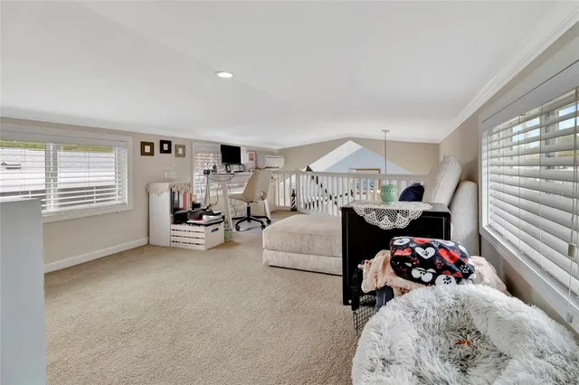 a bed room with furniture and a window