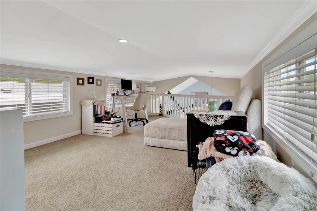 20285 Highway 27, Unit 38 Clermont, FL 34715 - Photo 15 of 33 a bed room with furniture and a window