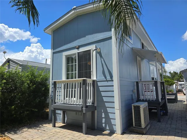 an aerial view of residential house with outdoor space and parking