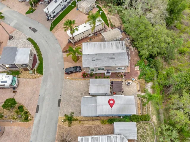 an aerial view of a house with outdoor space
