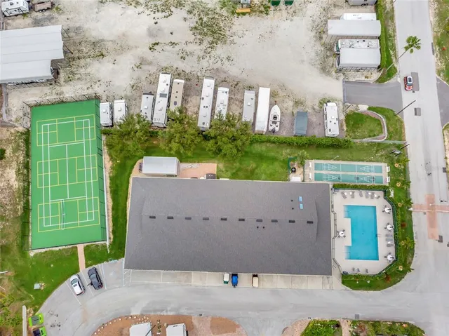 an aerial view of a house with outdoor space