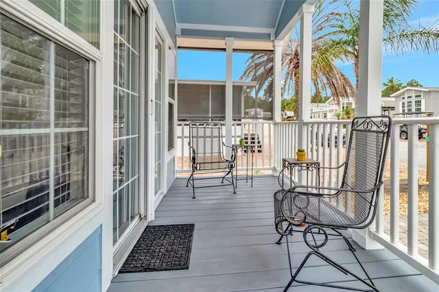 a view of a balcony with furniture
