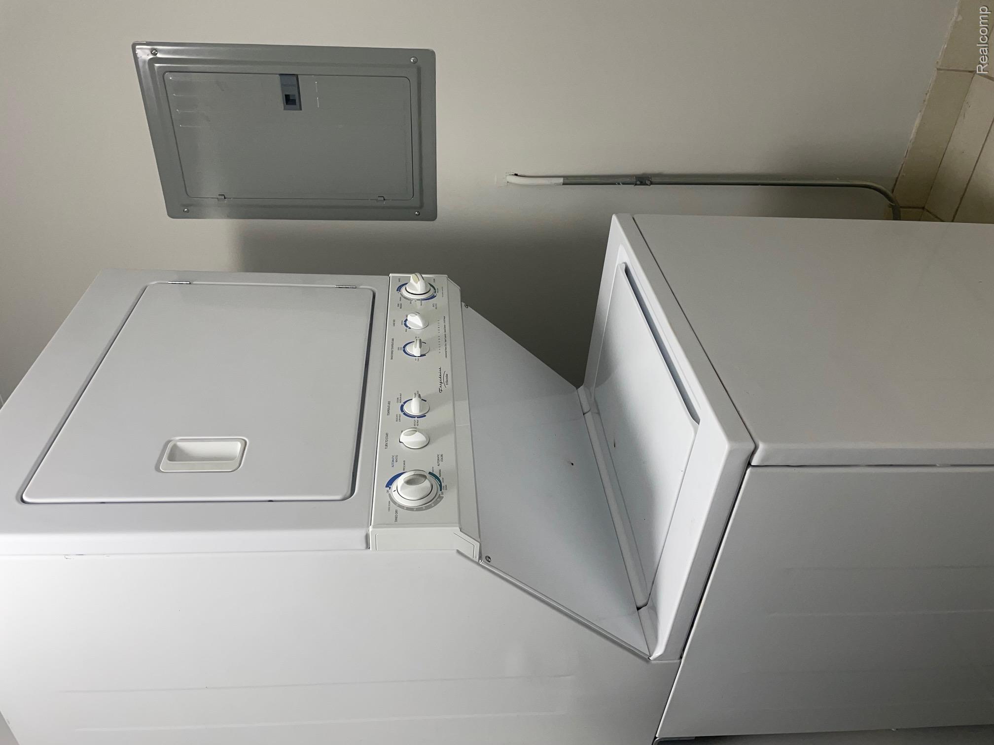 2727 East Maple Road Birmingham, MI 48009 - Photo 27 of 29 Stacked white laundry appliances