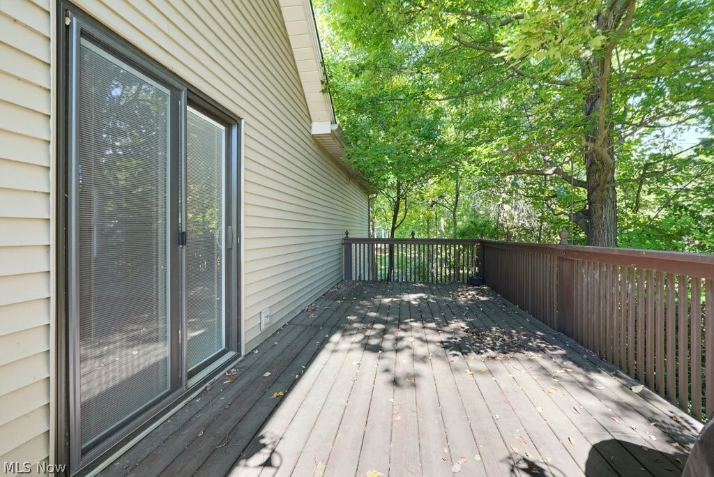 Expansive wood-finish deck with a full railing system