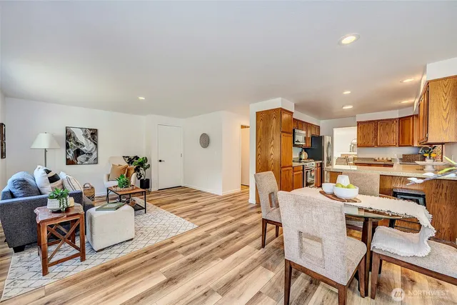 a living room with furniture and kitchen view