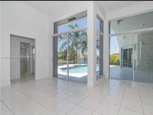 a bathroom with a glass door shower and a sink
