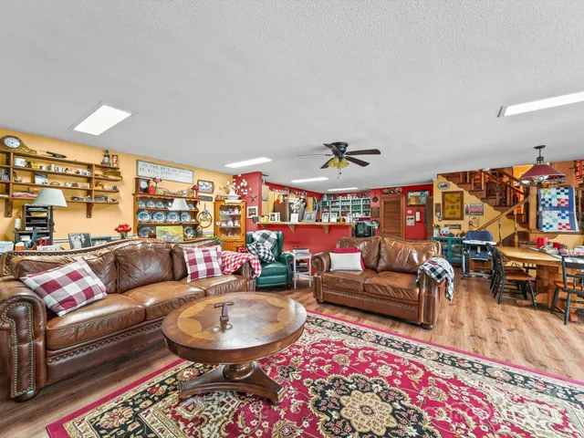 a living room with furniture and a rug