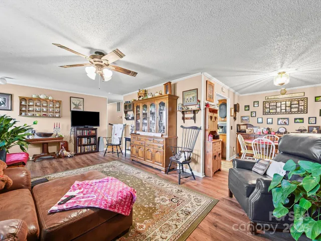 a bedroom with furniture and a flat screen tv