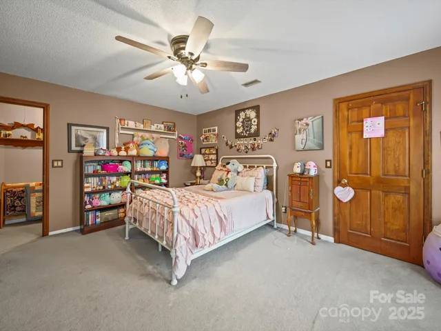 a bed room with a bed and a tv