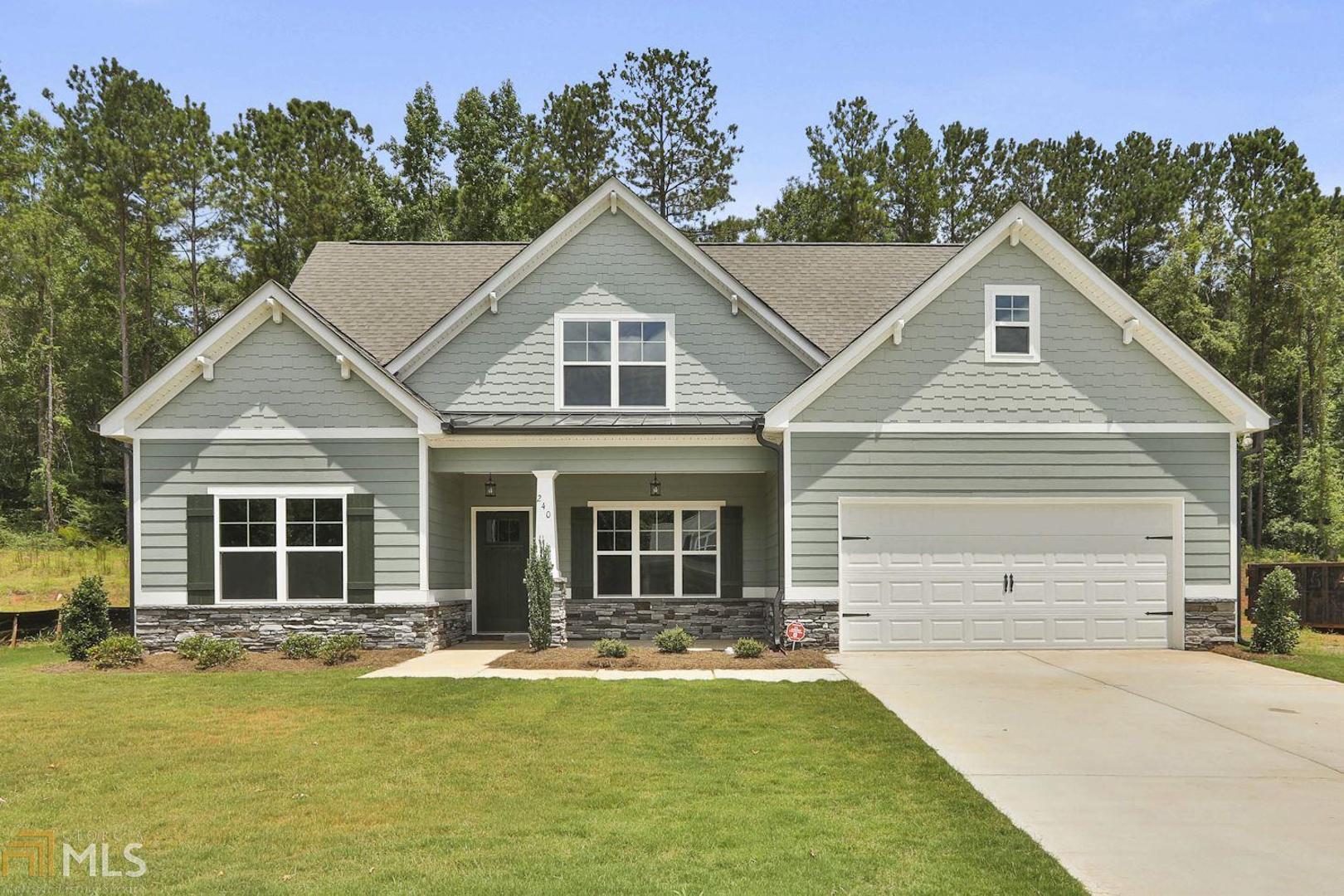 240 S Ridge, Unit 15 Senoia, GA 30276 - Photo 1 of 1 a front view of a house with a yard