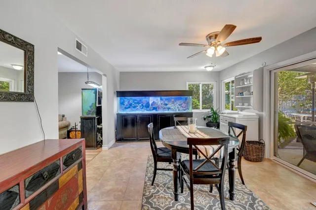 a view of a dining room with furniture and a livingroom