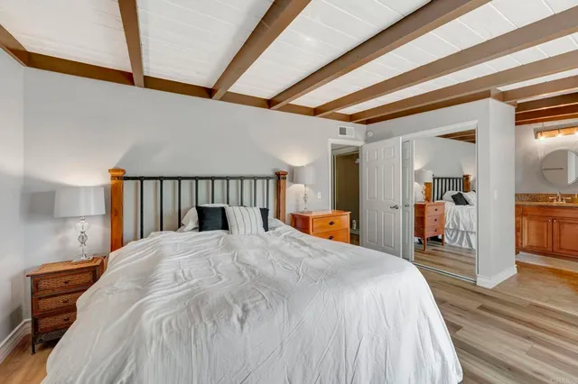 a bed room with a bed and a chair