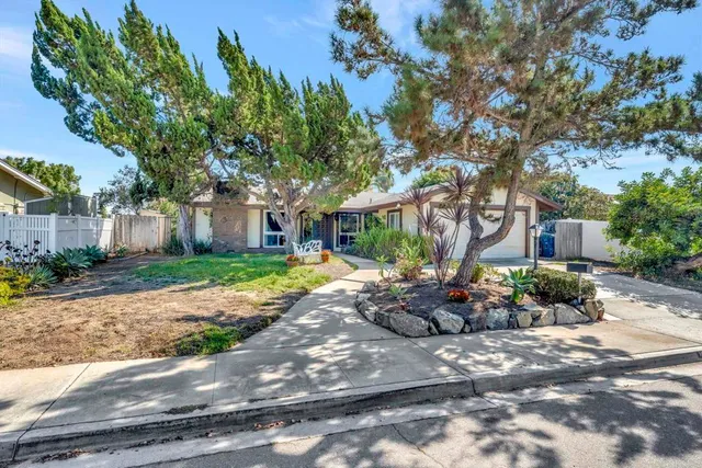 a view of a chair and tables in the patio