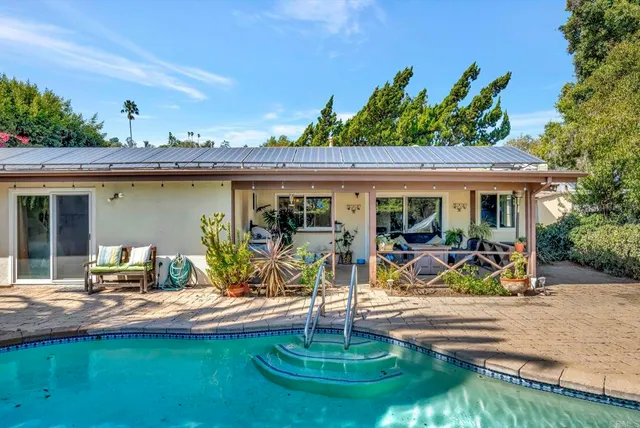 a view of a house with patio furniture and porch