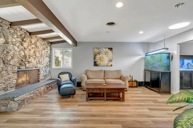 a living room with furniture and a fireplace