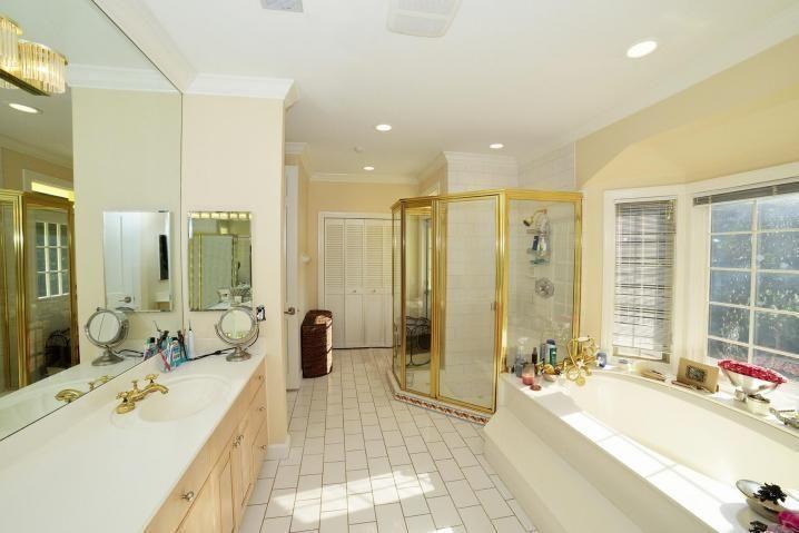 6167 Northwest 23rd Way Boca Raton, FL 33496 - Photo 20 of 28 a large bathroom with a tub sink shower and a mirror