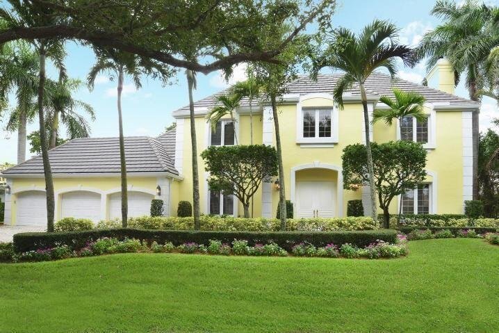 6167 Northwest 23rd Way Boca Raton, FL 33496 - Photo 2 of 28 a front view of house with yard and green space