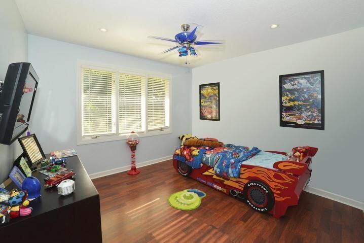 6167 Northwest 23rd Way Boca Raton, FL 33496 - Photo 23 of 28 a living room with furniture and a window