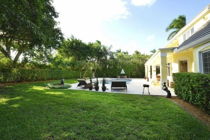 6167 Northwest 23rd Way Boca Raton, FL 33496 - Photo 28 of 28 a view of a house with backyard and sitting area