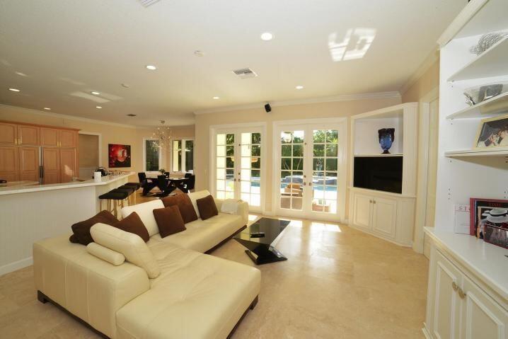 6167 Northwest 23rd Way Boca Raton, FL 33496 - Photo 5 of 28 a living room with furniture and a flat screen tv