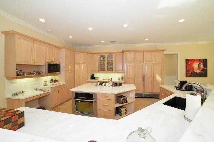 6167 Northwest 23rd Way Boca Raton, FL 33496 - Photo 6 of 28 a living room with stainless steel appliances kitchen island granite countertop a sink and cabinets