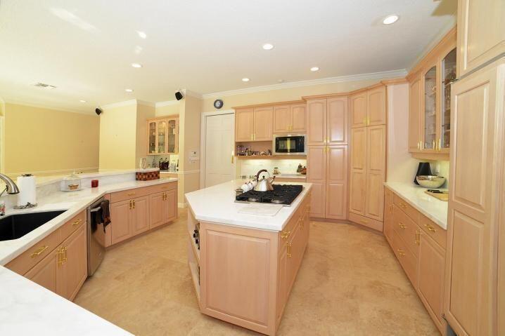 6167 Northwest 23rd Way Boca Raton, FL 33496 - Photo 7 of 28 a kitchen with a sink a stove top oven a counter space and a window