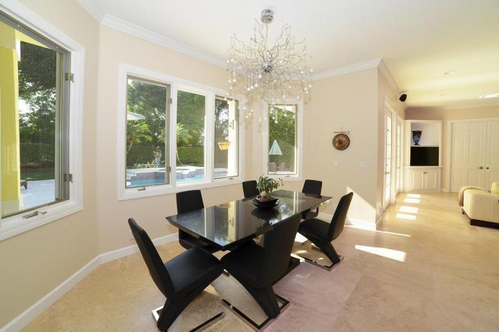 6167 Northwest 23rd Way Boca Raton, FL 33496 - Photo 10 of 28 a dining room with furniture and wooden floor