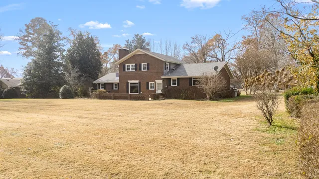 a view of large yard with a house