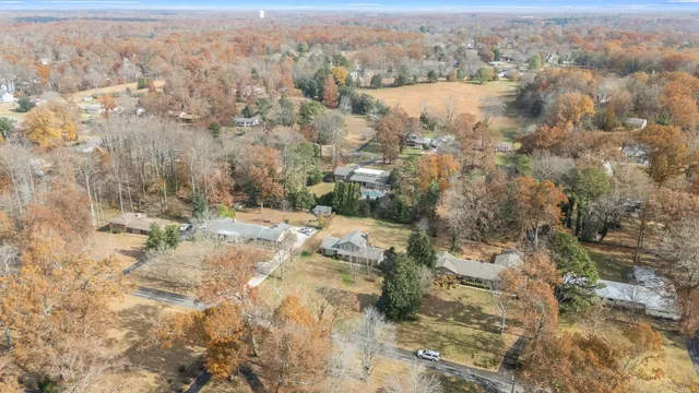 an aerial view of house with yard and mountain view