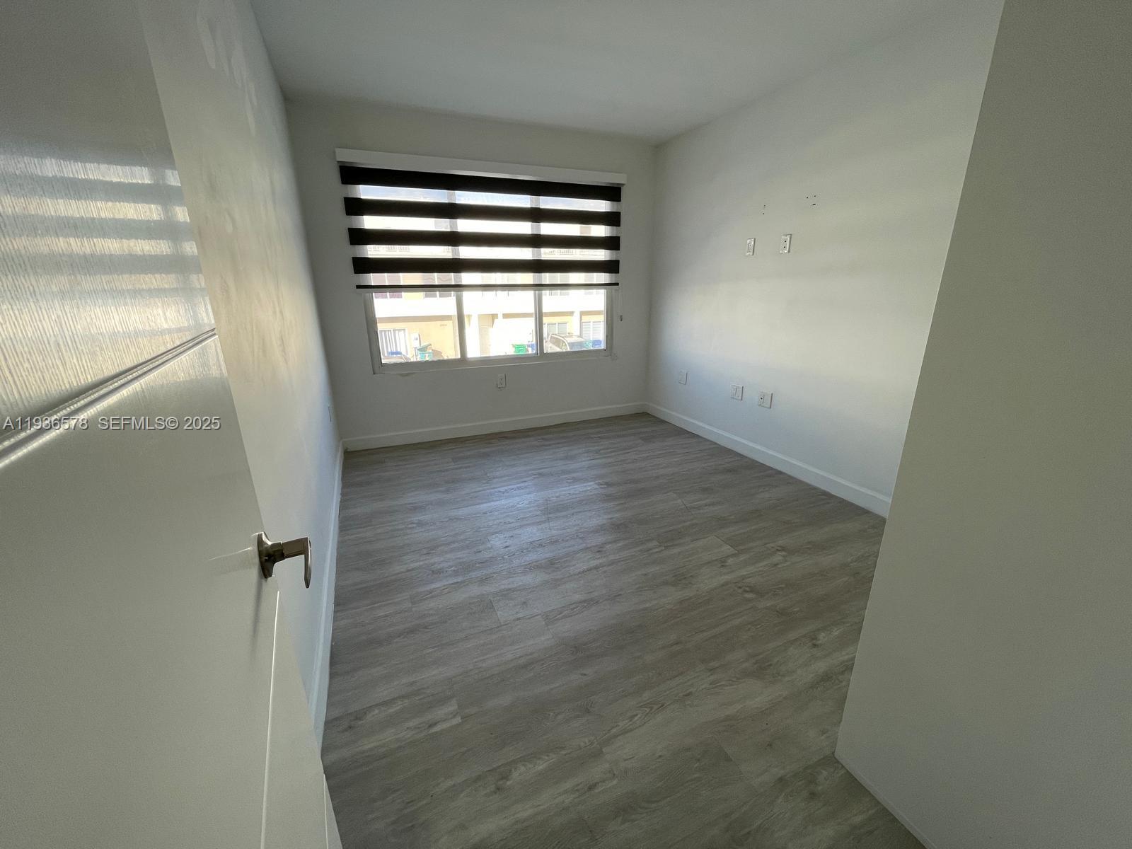 25869 Southwest 139th Court Homestead, FL 33032 - Photo 12 of 22 a view of an empty room with a window