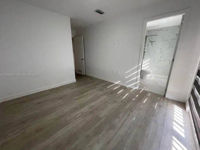 a bathroom with a sink vanity and a mirror