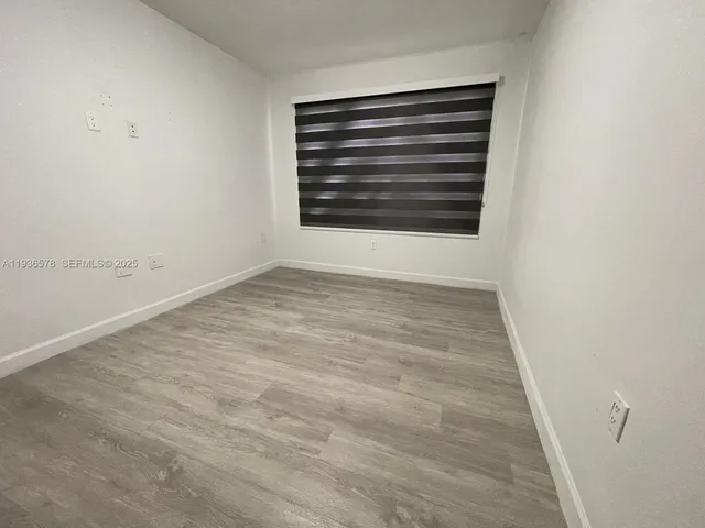 an empty room with mirror