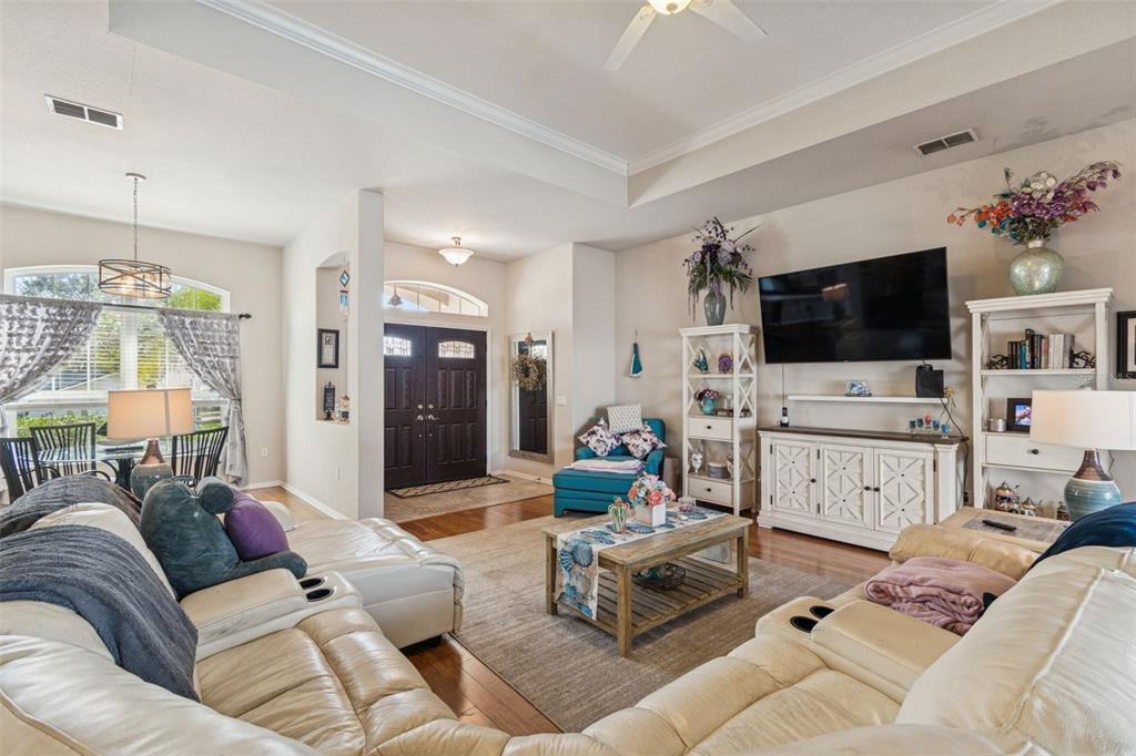 5287 Slater Road Spring Hill, FL 34608 - Photo 12 of 86 a living room with furniture and a flat screen tv